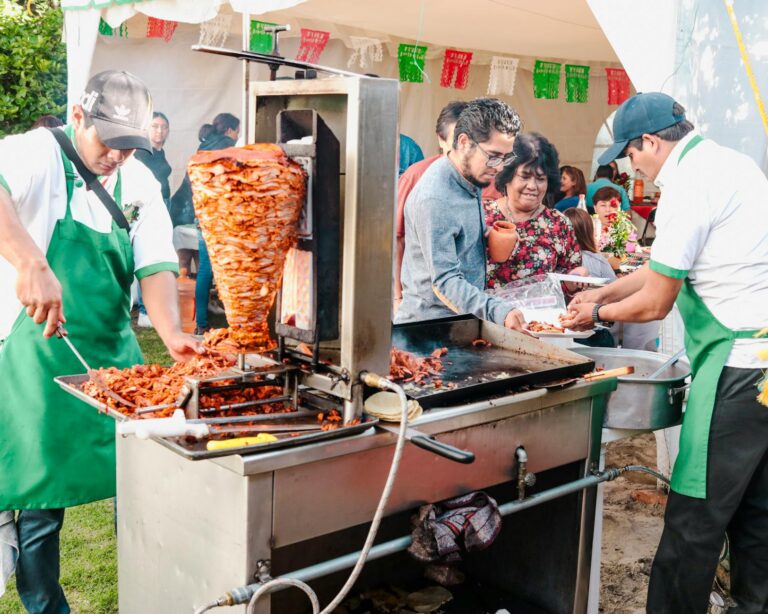 outdoor mexican street food event with tacos al pastor