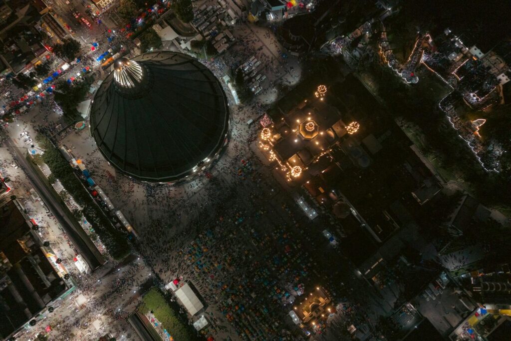 High-angle aerial shot of a lively night festival in Monterrey, Mexico.